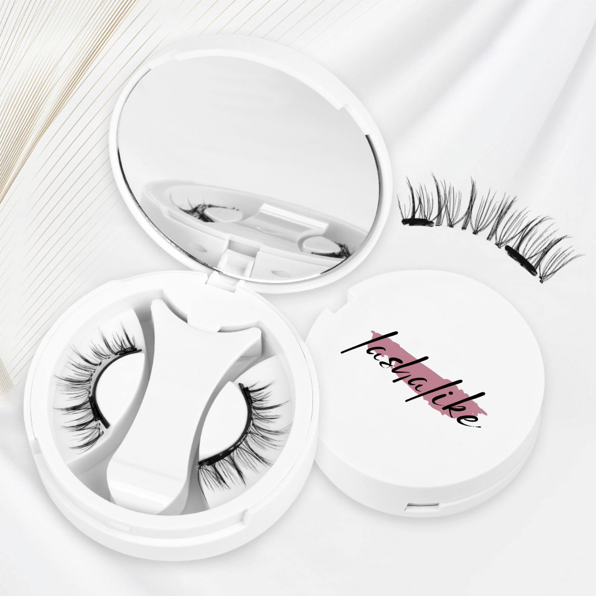 False eyelashes in a white case with 'Tasha' branding on a light background